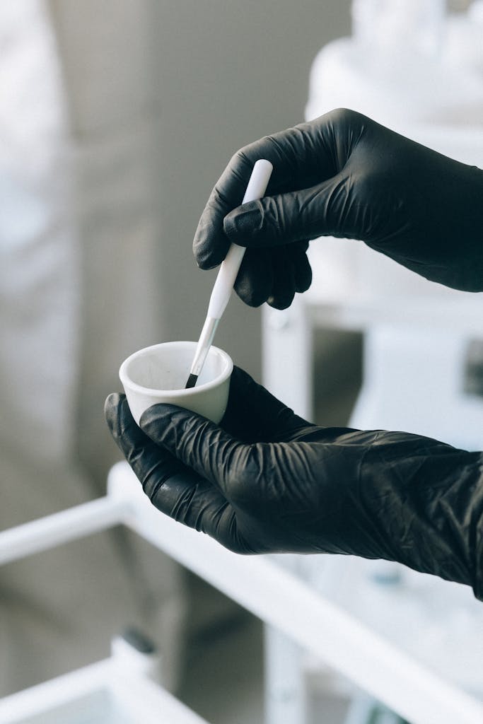 Person Holding White Ceramic Mug With White Plastic Spoon